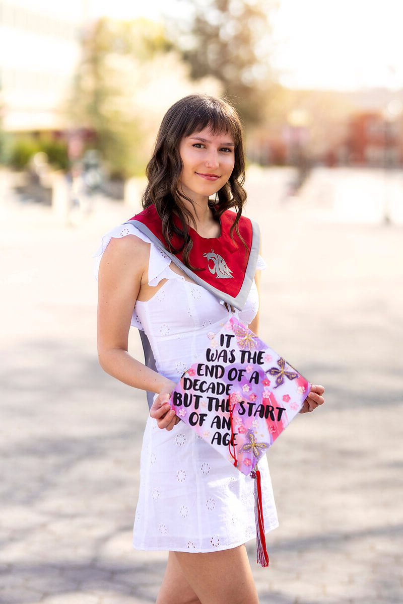 A white dress with lace or some other feature is super flattering for college graduation portraits