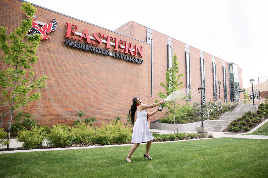 Popping champagne for college graduation pictures at EWU in Cheney, WA