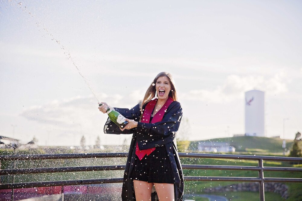 Popping a Bottle of Champagne at Your Grad Session - 