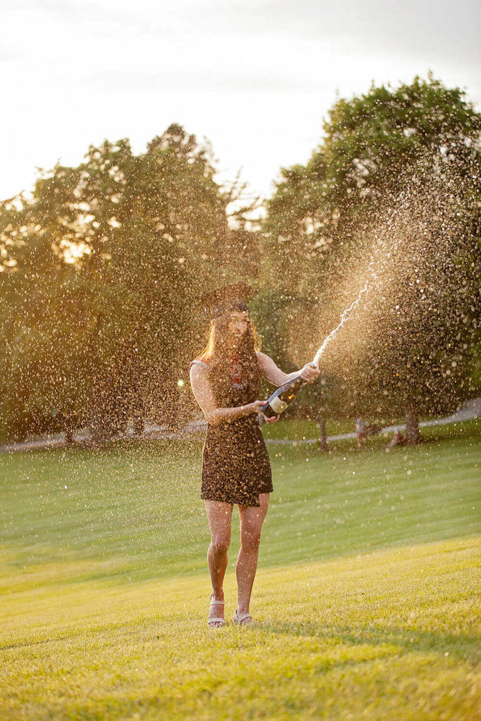 Popping champagne for college senior pictures