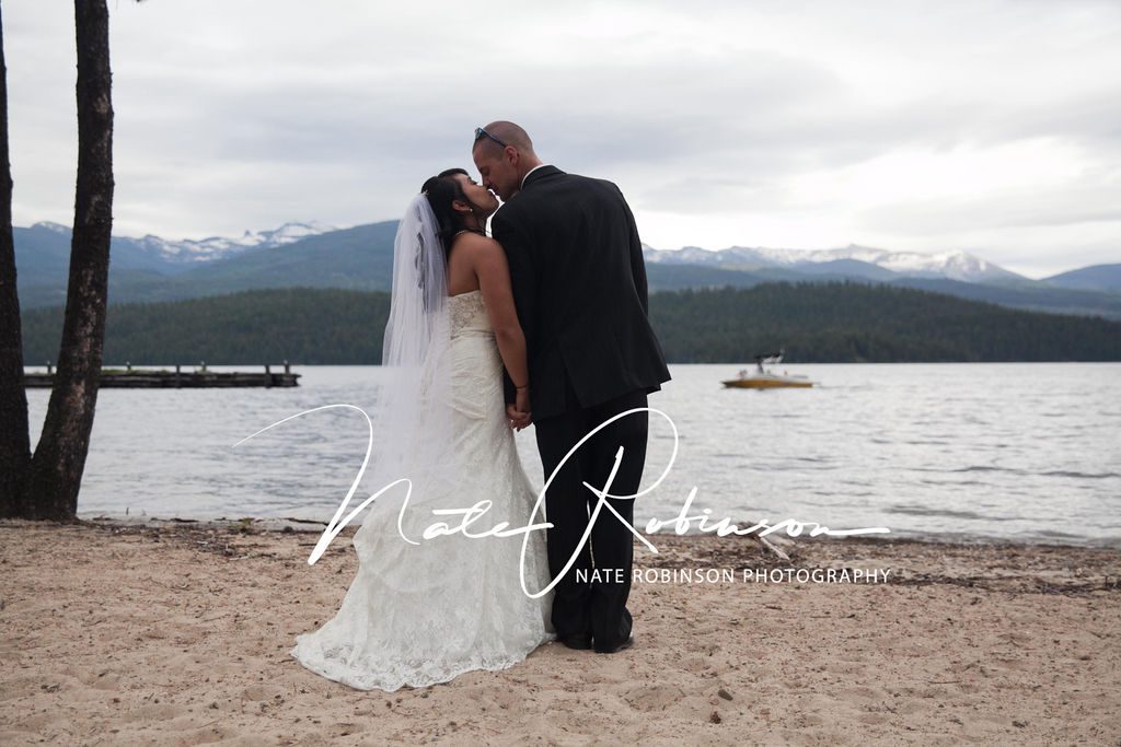bride and groom sharing a kiss on the beach in Washington