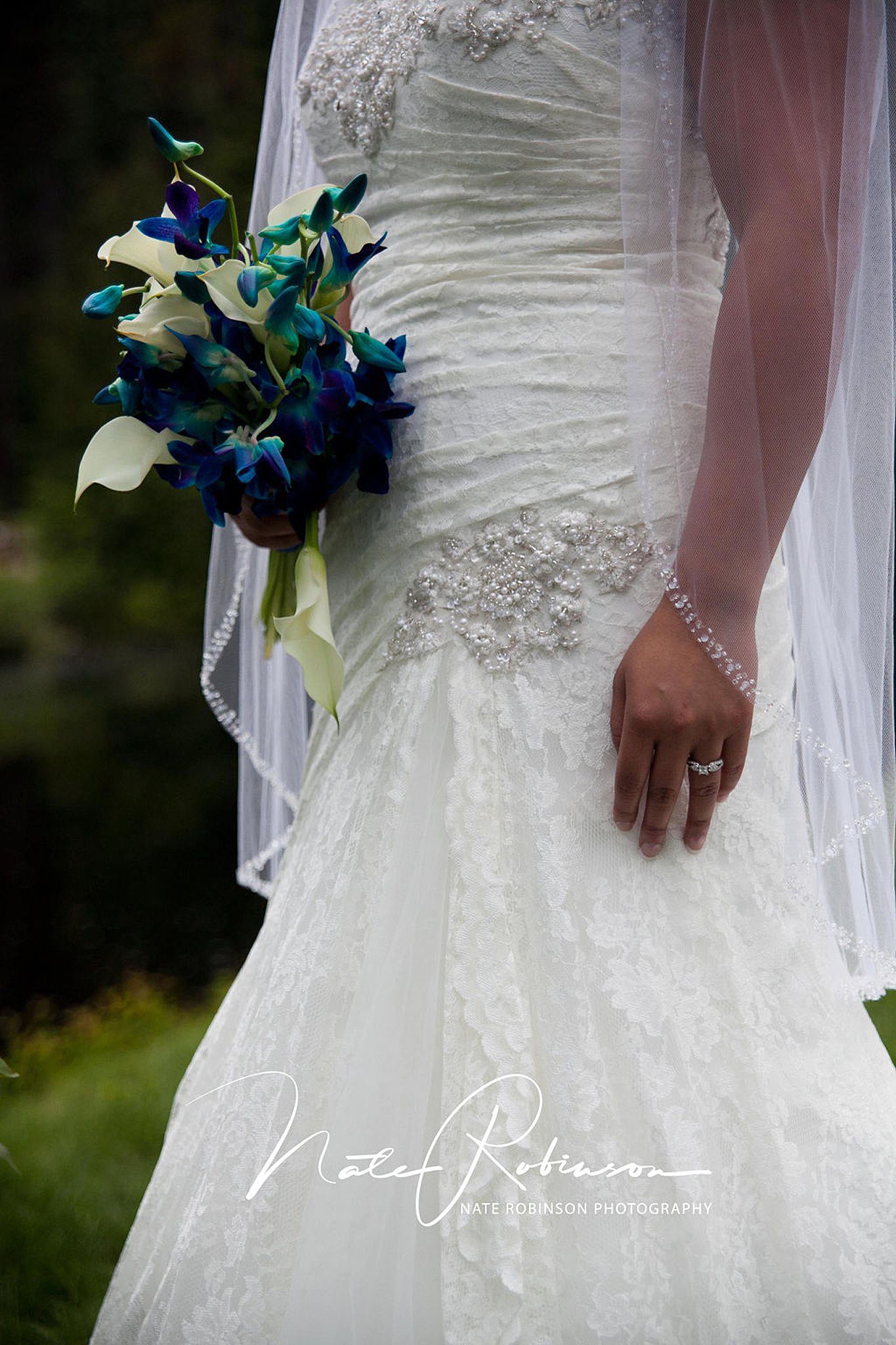 women's wedding gown with her wedding bouquet