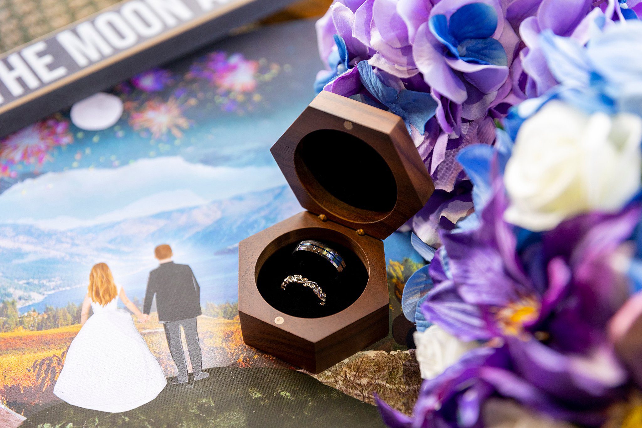rings in a ring box with purple flowers Lavender Manor wedding