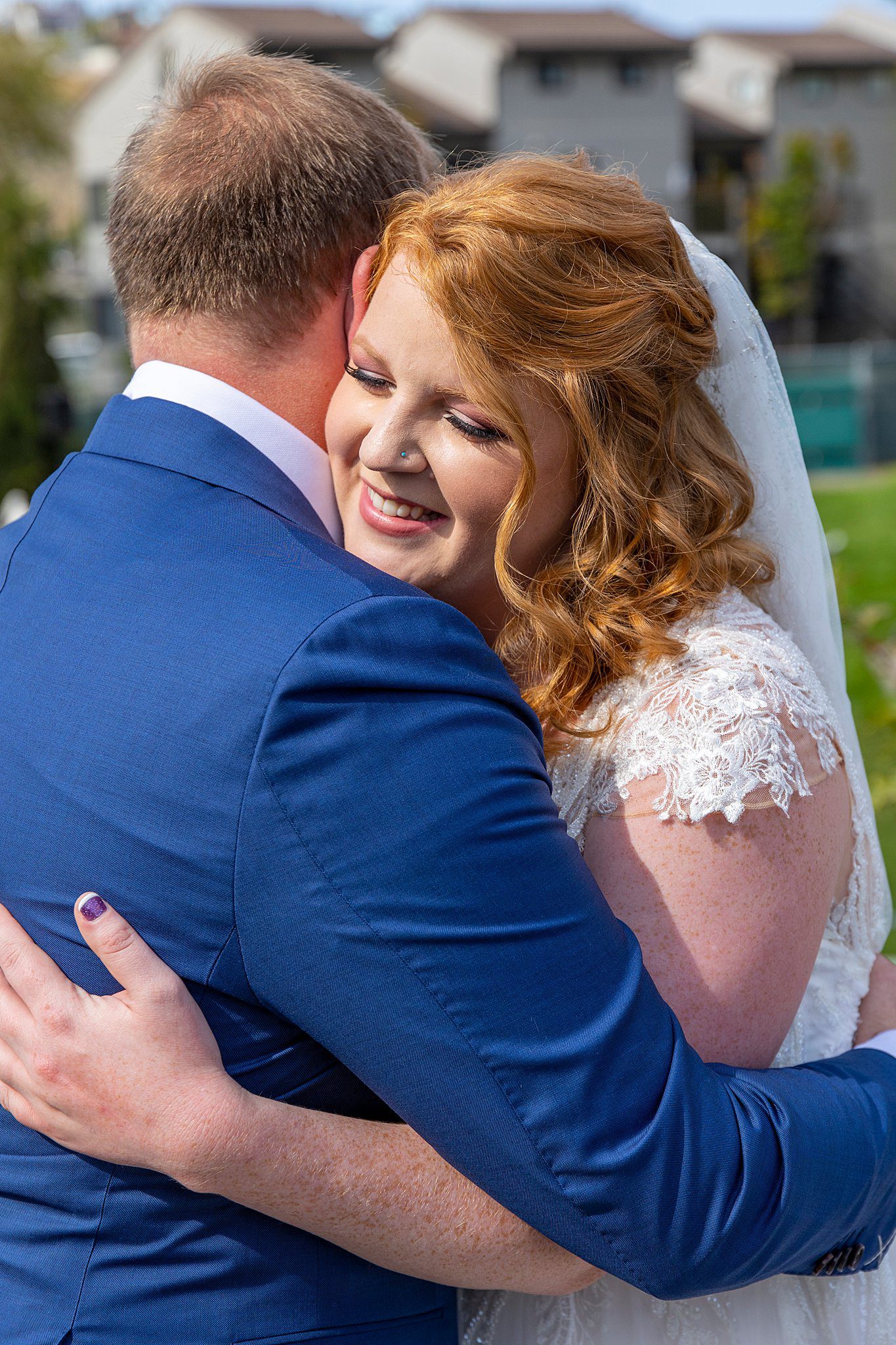 bride and groom hugging during their first look at their Lavender Manor wedding