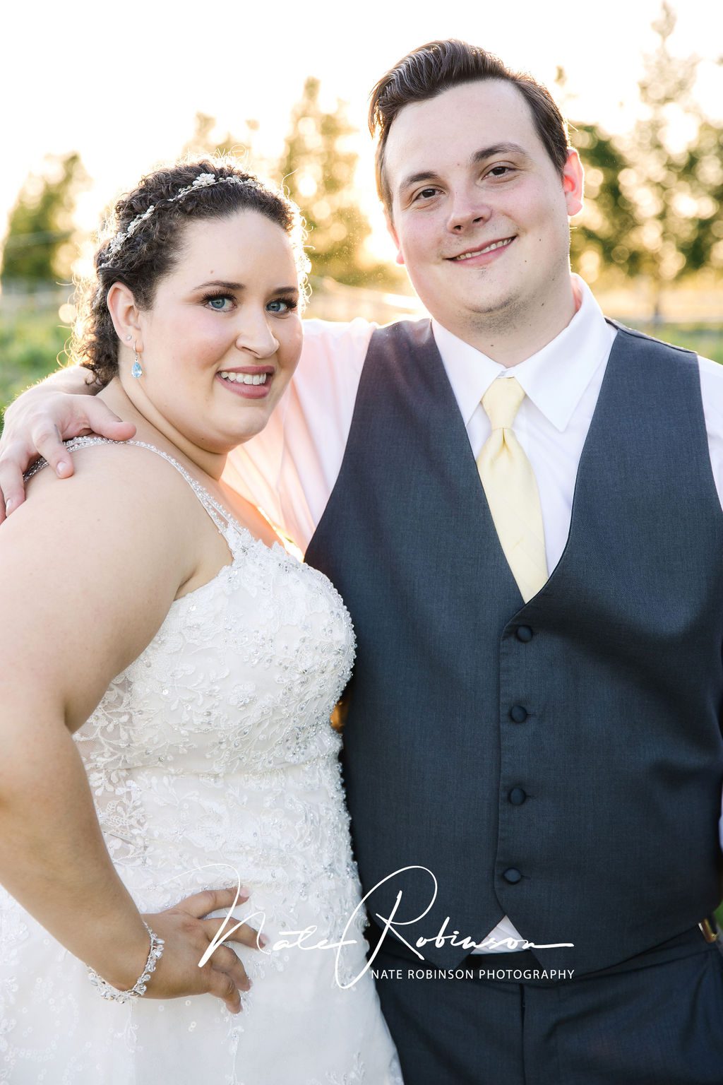 bride and groom smiling at their farmhouse on green bluff wedding