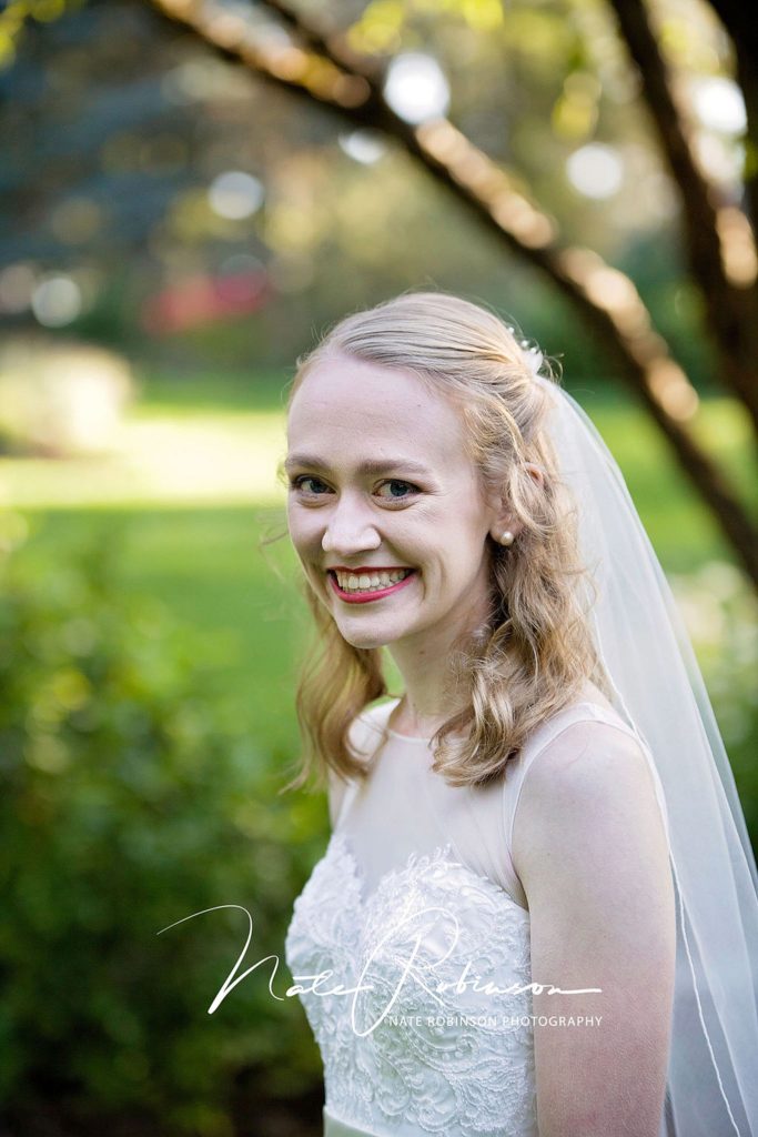 bride smiling in a park near Spokane