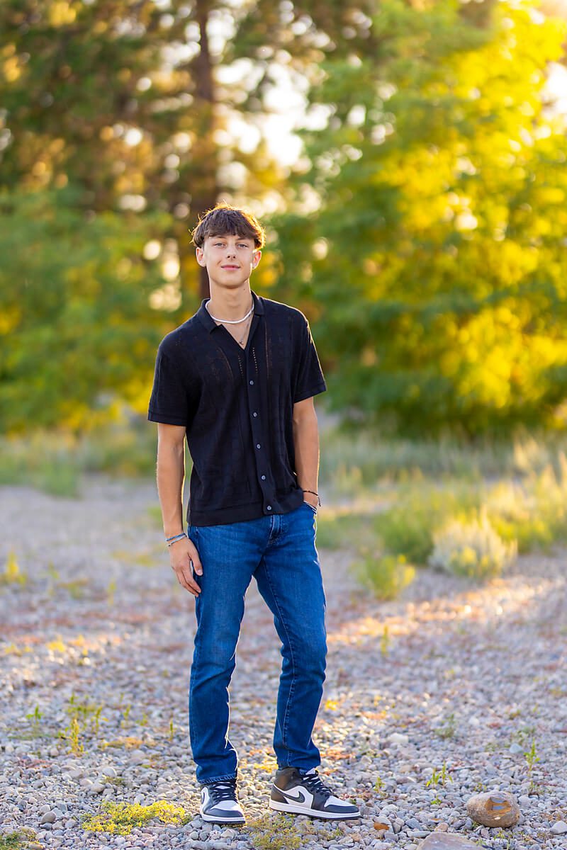 High school senior guy in glowy outdoor setting in a nice casual outfit having completed Spokane Driver's Ed