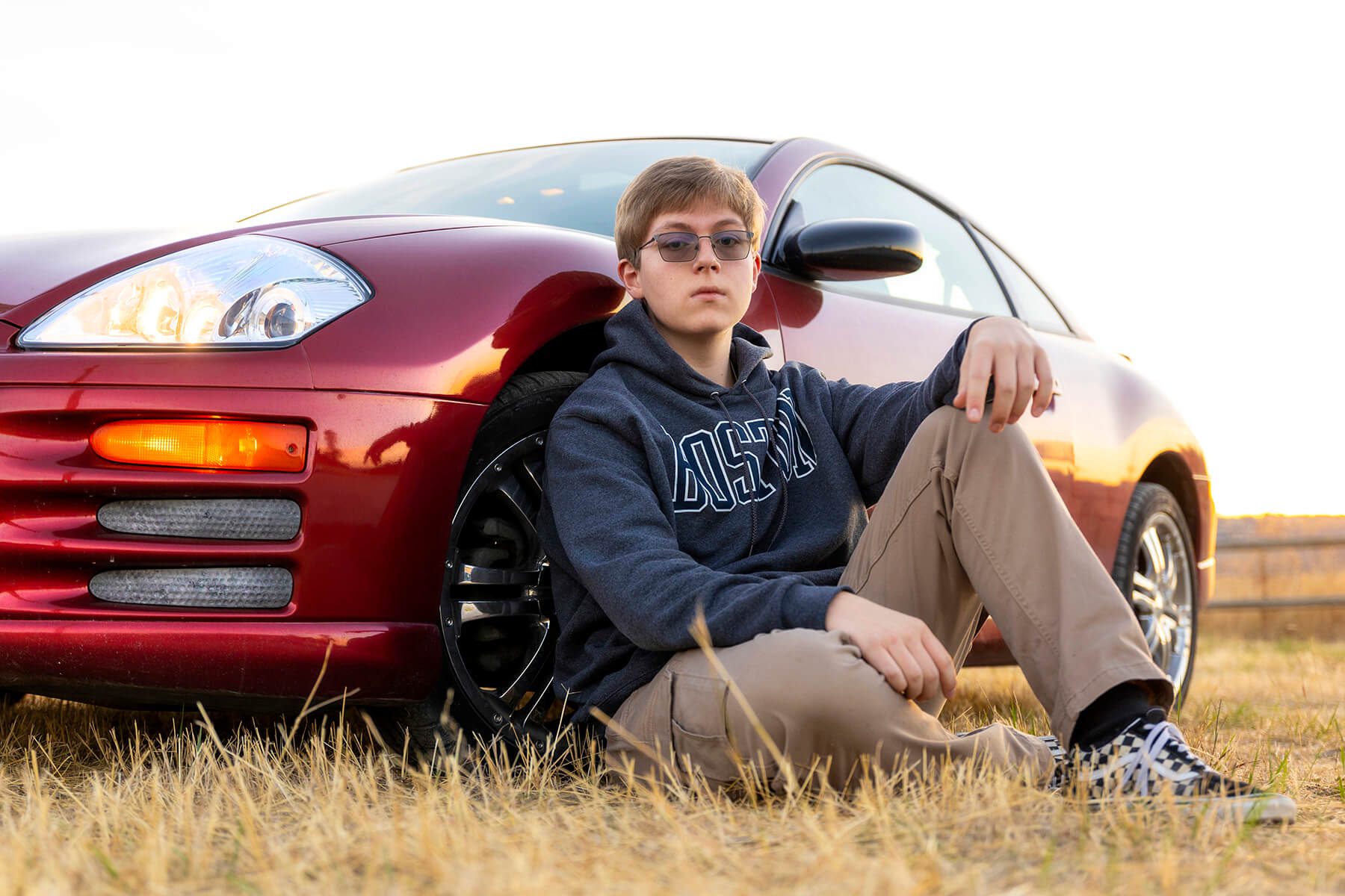 Spokane senior guy pictures in front of his car