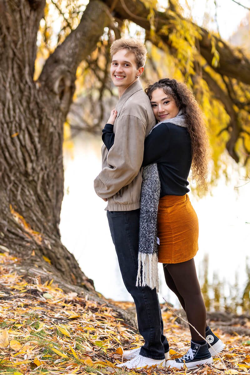 Fall couple wearing orange and brown fall outfits